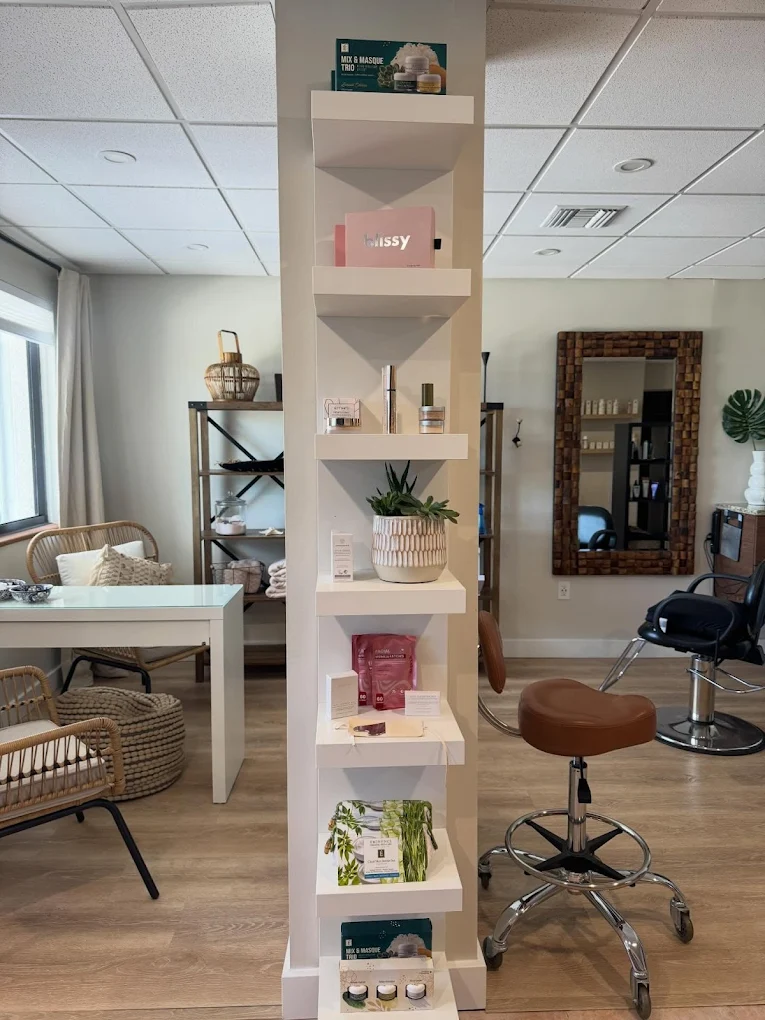 Curated organic beauty retail shelf inside Vista Beauty Bar in Marathon, FL